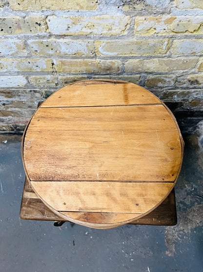 Vintage wooden cheese wheel storage box.