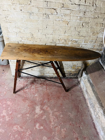 Vintage wooden folding ironing board.