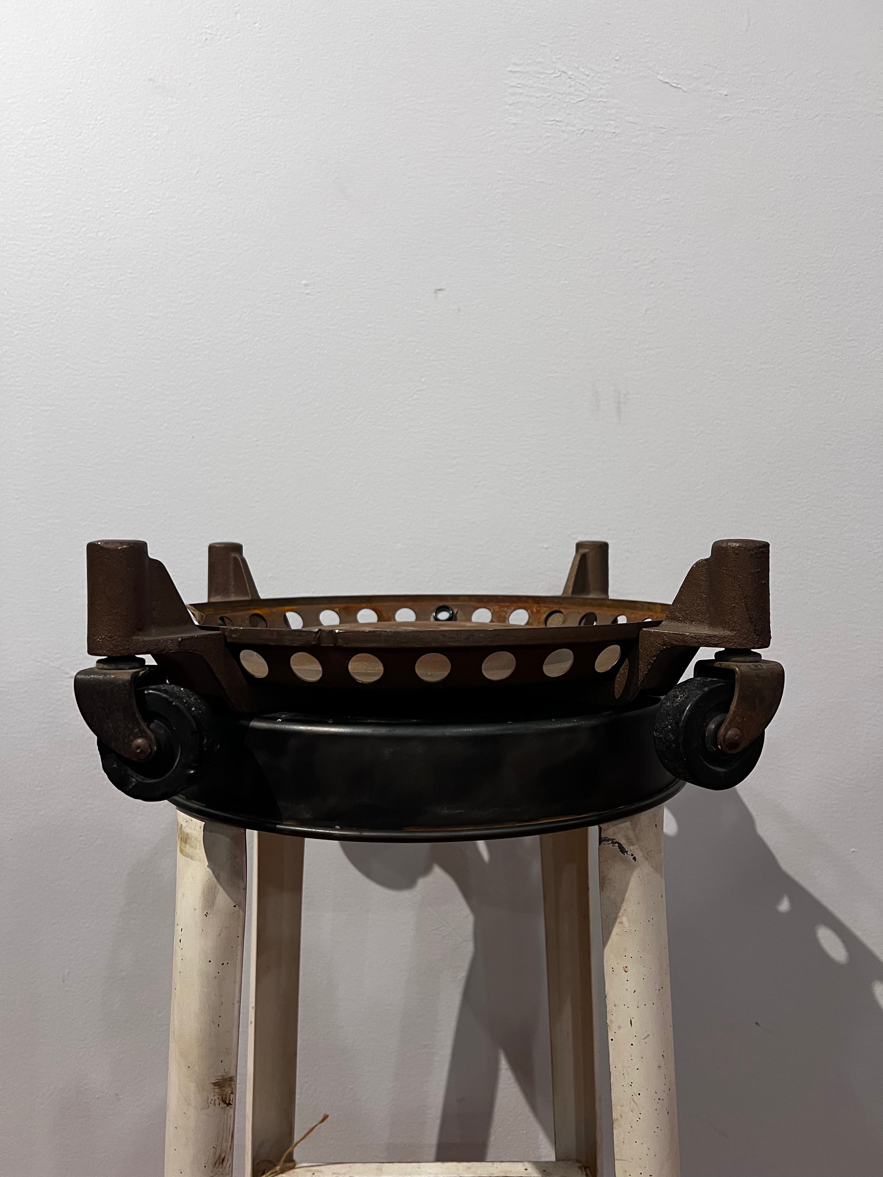 Antique metal rolling base